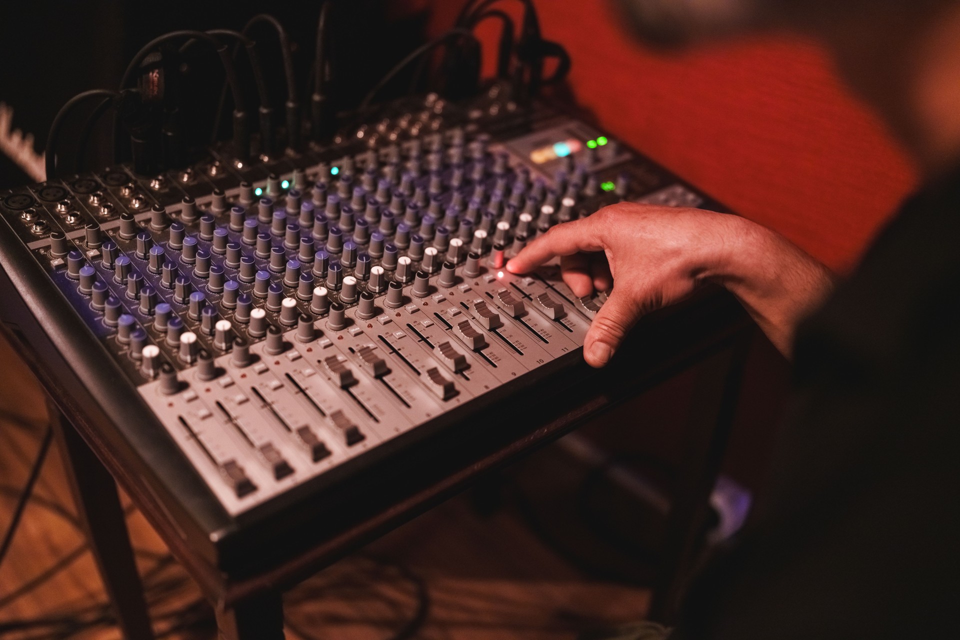 Recording music in studio, hands on equaliser.